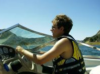 Woman driving boat